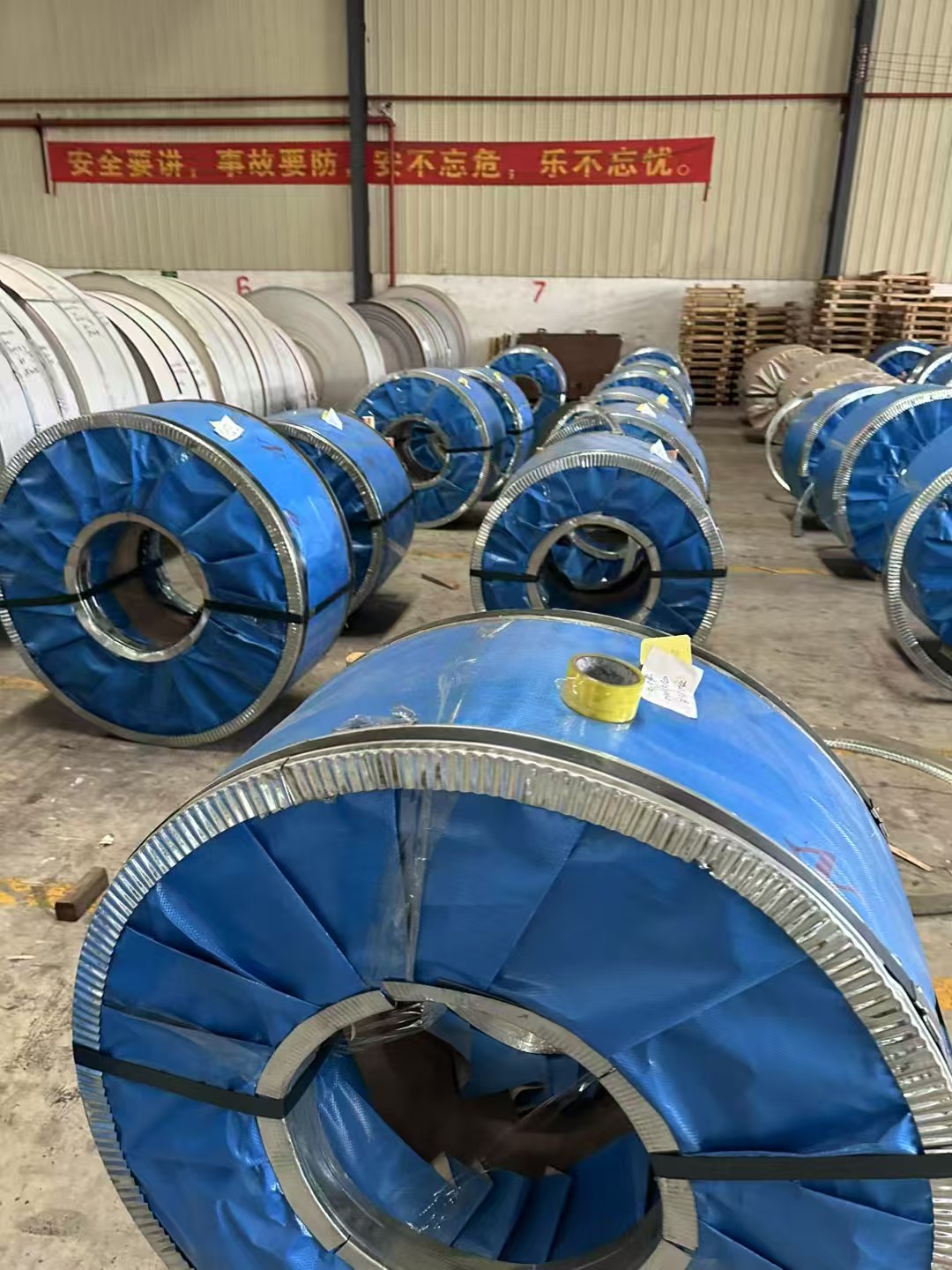 Blue protective wrapping on stainless steel coils
