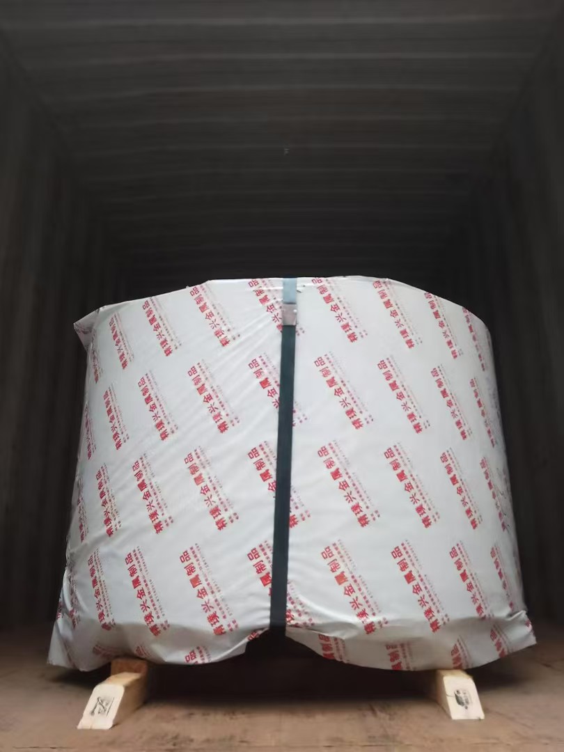 A protected stainless steel coil secured for handling